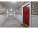 Hallway with tan horizontal siding and red door at 2700 Pine Tree Ne Rd # 2306, Atlanta, GA 30324