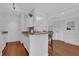 Cozy kitchen with white cabinetry, granite countertops, breakfast bar with seating at 2700 Pine Tree Ne Rd # 2306, Atlanta, GA 30324