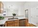 Kitchen with stainless steel appliances and light wood cabinets at 322 Ravinia Way, Lawrenceville, GA 30044