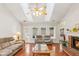 Living room featuring hardwood floors, a fireplace, and lots of natural light at 322 Ravinia Way, Lawrenceville, GA 30044