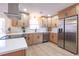 Modern kitchen boasts stainless steel appliances and light wood cabinets at 482 Breakwater Ter, Stone Mountain, GA 30087