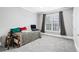 Bedroom with daybed, large window and gray carpet at 4100 Paces Se Walk # 2304, Atlanta, GA 30339
