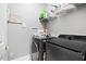 Laundry room with washer, dryer, and shelving at 4100 Paces Se Walk # 2304, Atlanta, GA 30339