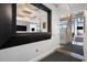 Hallway with modern design, showcasing exposed concrete columns and views into other rooms at 434 Marietta Nw St # 303, Atlanta, GA 30313