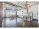 Spacious living room with a dining area, concrete floors, and large windows at 434 Marietta Nw St # 303, Atlanta, GA 30313