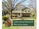 Two-story house with green and brown siding, landscaping, and a spacious yard at 4819 Elam Rd, Stone Mountain, GA 30083