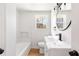 Modern bathroom with white vanity and bathtub at 771 N Burnt Hickory N Rd, Douglasville, GA 30134