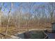 Wooded backyard with clearing and deck access at 1422 Hillside Dr, Grayson, GA 30017