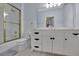 Bathroom with double vanity, shower, and updated fixtures at 1422 Hillside Dr, Grayson, GA 30017