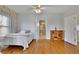 Bright bedroom with hardwood floors and access to bathroom at 1422 Hillside Dr, Grayson, GA 30017