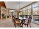 Sunlit dining room features a wooden table and access to the kitchen at 1422 Hillside Dr, Grayson, GA 30017