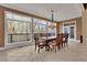 Elegant dining room with large windows and chandelier at 1422 Hillside Dr, Grayson, GA 30017