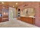 Spacious kitchen with wood cabinets and brick accent wall at 1422 Hillside Dr, Grayson, GA 30017