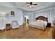 Spacious main bedroom with hardwood floors and sitting area at 1422 Hillside Dr, Grayson, GA 30017