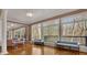 Bright sunroom with hardwood floors and abundant natural light at 1422 Hillside Dr, Grayson, GA 30017