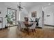 Modern dining room with hardwood floors and large window at 1822 Avon Sw Ave, Atlanta, GA 30311