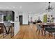 Open concept dining area with hardwood floors and modern table at 1822 Avon Sw Ave, Atlanta, GA 30311