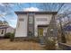 Modern two-story home with gray and white exterior, and a yellow door at 1822 Avon Sw Ave, Atlanta, GA 30311