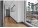 Hallway with large window providing views of the neighborhood and natural light at 1822 Avon Sw Ave, Atlanta, GA 30311