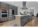 Sleek kitchen with stainless steel appliances, a large island, and contemporary finishes at 1822 Avon Sw Ave, Atlanta, GA 30311