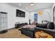 Living room with sectional sofa, hardwood floors, and modern decor at 1822 Avon Sw Ave, Atlanta, GA 30311