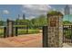 Entrance to Centennial Olympic Park in Atlanta, featuring stone pillars and wrought iron gates at 1822 Avon Sw Ave, Atlanta, GA 30311