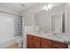 Bathroom with double vanity, neutral decor, and a shower/tub combo at 3164 Sw Wolf Club Sw Dr, Atlanta, GA 30349