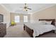 Spacious bedroom with carpeted floors and a ceiling fan at 3164 Sw Wolf Club Sw Dr, Atlanta, GA 30349