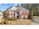 Brick two-story house with landscaped yard and driveway at 3164 Sw Wolf Club Sw Dr, Atlanta, GA 30349