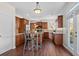 Bright kitchen with an island, hardwood floors, and access to a backyard at 3164 Sw Wolf Club Sw Dr, Atlanta, GA 30349