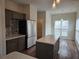 Modern kitchen featuring stainless steel appliances, an island, and stylish backsplash at 4019 Kingsbrook Blvd, Decatur, GA 30034