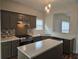 Modern kitchen with stainless steel range, quartz countertops and ample cabinet space at 4019 Kingsbrook Blvd, Decatur, GA 30034