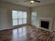 Cozy living room featuring hardwood floors, fireplace, and plenty of natural light at 4019 Kingsbrook Blvd, Decatur, GA 30034