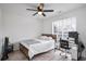 Bedroom with desk, ceiling fan and a queen bed at 559 Ransom Way, Stockbridge, GA 30281