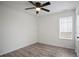 Spacious bedroom with ceiling fan and light grey wood flooring at 559 Ransom Way, Stockbridge, GA 30281