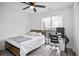 Bedroom with desk, ceiling fan and a queen bed at 559 Ransom Way, Stockbridge, GA 30281