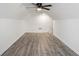 Bright bonus room with wood-look flooring and ceiling fan at 559 Ransom Way, Stockbridge, GA 30281