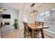 Breakfast nook with wood dining table and view into living room at 559 Ransom Way, Stockbridge, GA 30281