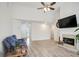 Bright living room featuring hardwood floors, fireplace, and ample natural light at 559 Ransom Way, Stockbridge, GA 30281