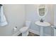 Small half bathroom with pedestal sink and toilet at 125 Hidden Creek Dr, Canton, GA 30114