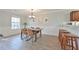 Spacious dining area with wood table and chairs, features wood flooring at 125 Hidden Creek Dr, Canton, GA 30114