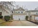 Two-story home with double garage and manicured landscaping at 125 Hidden Creek Dr, Canton, GA 30114