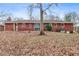 Large backyard with mature trees and a spacious lawn at 1730 Carla Dr, Morrow, GA 30260