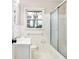 Clean bathroom with white tile and a shower/tub combo at 1730 Carla Dr, Morrow, GA 30260