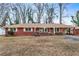 Brick ranch home with mature trees and a spacious yard at 1730 Carla Dr, Morrow, GA 30260