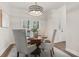 Elegant dining room with round table and four chairs at 2085 Melrose Trce, Cumming, GA 30041