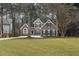 Two-story house with gray siding and manicured lawn at 2085 Melrose Trce, Cumming, GA 30041