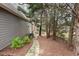 Landscaped side yard with stone pathway and lush greenery at 2085 Melrose Trce, Cumming, GA 30041