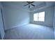 Bright bedroom with carpeted floor and ceiling fan at 3284 Pennington Dr, Lithonia, GA 30038