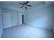 Spacious bedroom with carpeted floor and ceiling fan at 3284 Pennington Dr, Lithonia, GA 30038